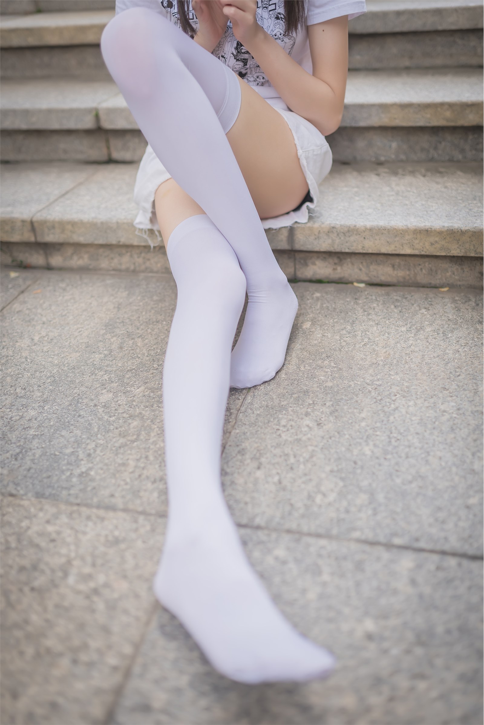 Rabbit plays with painted white stockings over the knee(1)